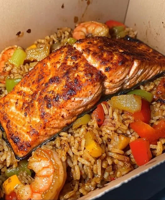 Cajun salmon and shrimp served in a dirty rice bowl