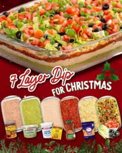 Delicious 7 Layer Dip with vibrant, colorful ingredients in a serving dish.