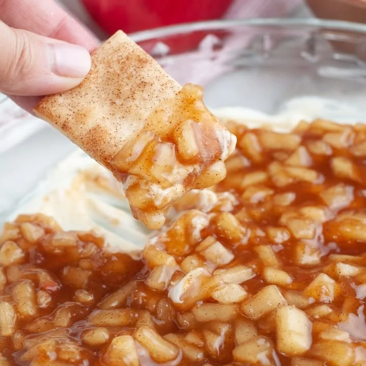 Delicious apple pie dip served in a bowl with cinnamon and apple slices