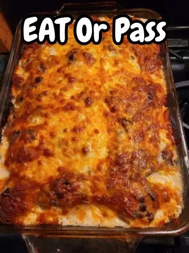 Delicious breakfast casserole with biscuits and gravy served in a baking dish