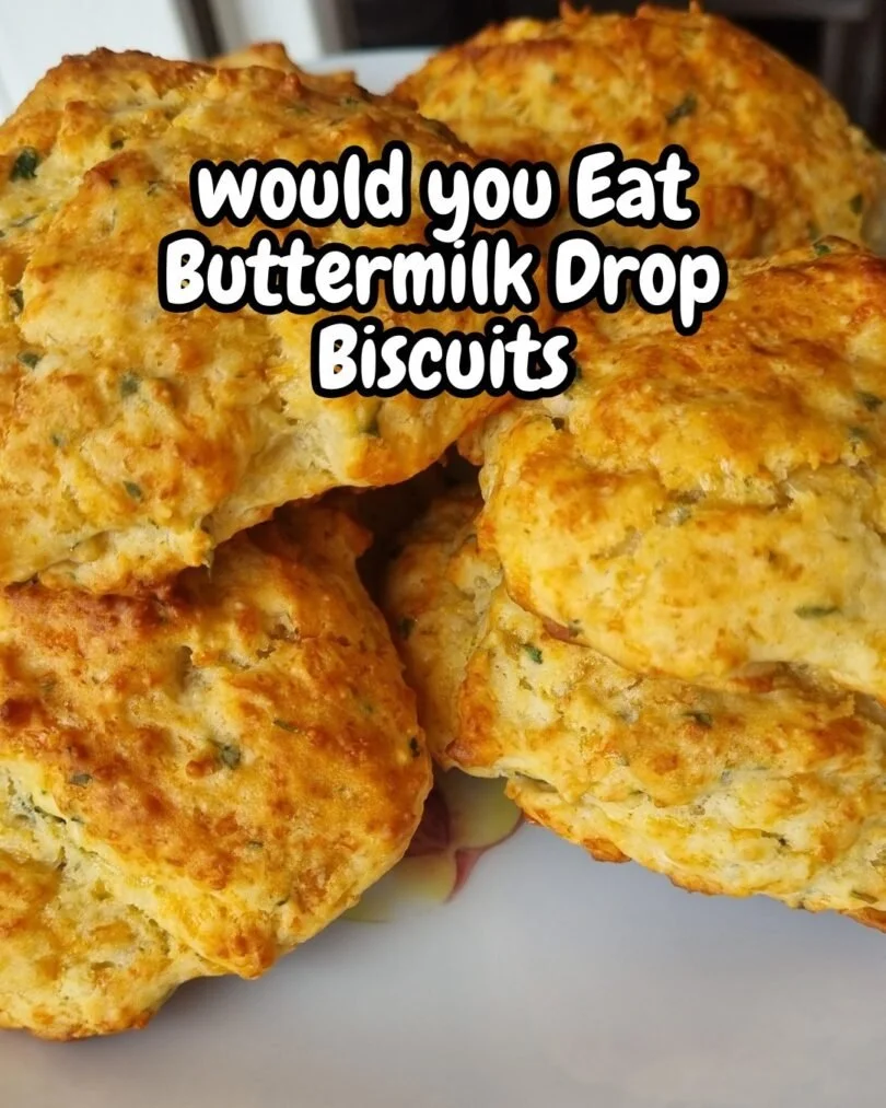 Fluffy buttermilk drop biscuits freshly baked on a cooling rack