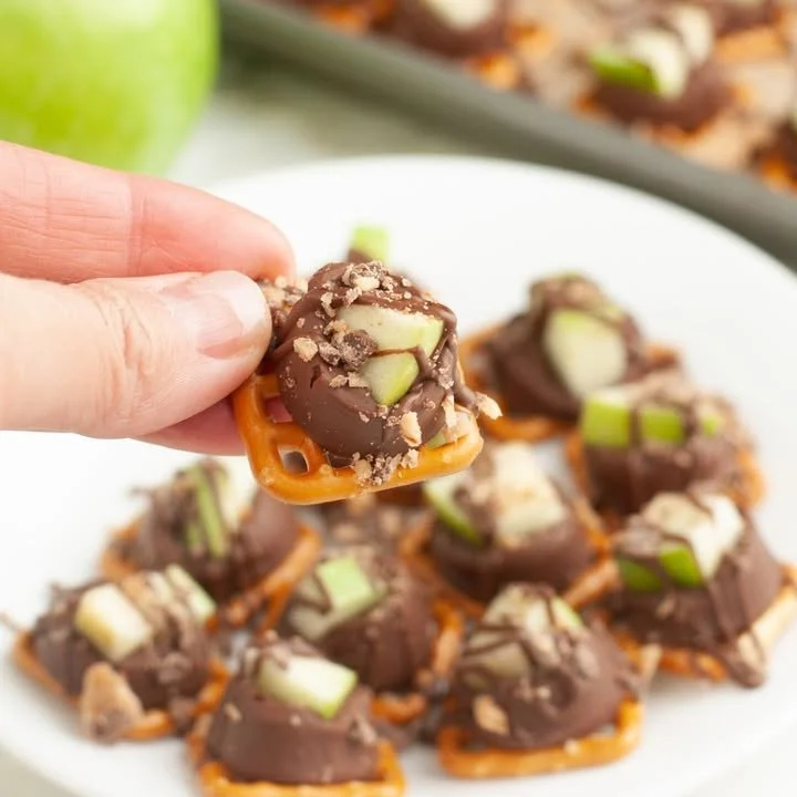 Delicious caramel apple bites topped with nuts and sprinkles