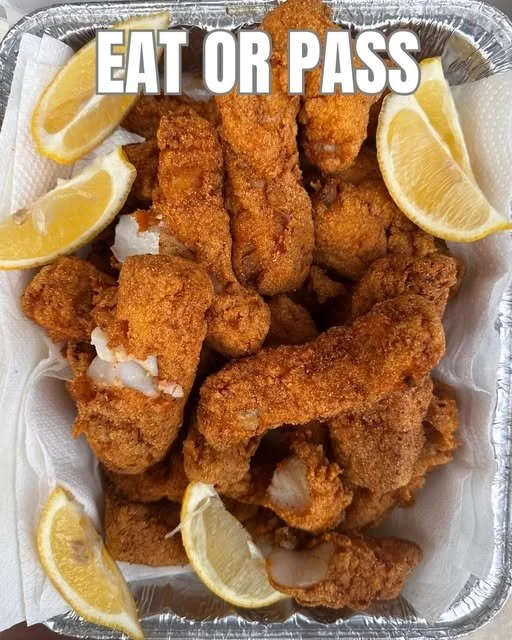 Fried catfish served with crispy hush puppies on a plate
