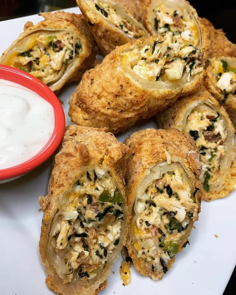 Delicious Chicken Egg Rolls served with vibrant red pepper salsa
