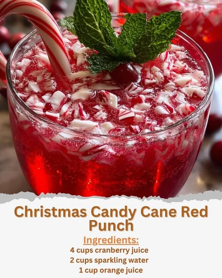 Festive Christmas Candy Cane Red Punch in a glass with candy cane garnish.