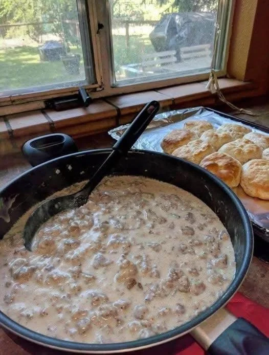 Bowl of classic sausage gravy served over biscuits for a hearty breakfast.