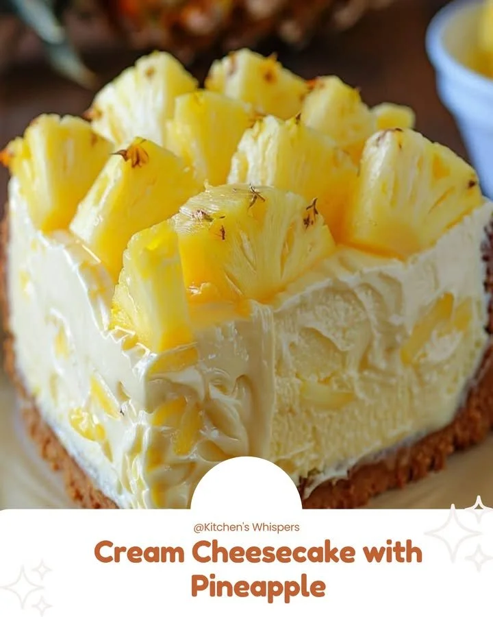 Cream cheesecake topped with fresh pineapple slices.