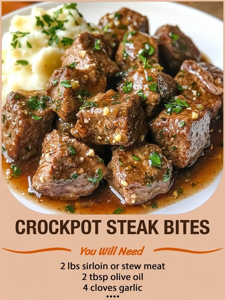 Crockpot steak bites served on a plate with herbs and spices.