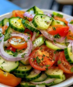 Cucumber Tomato Onion Salad fresh ingredients in a bowl