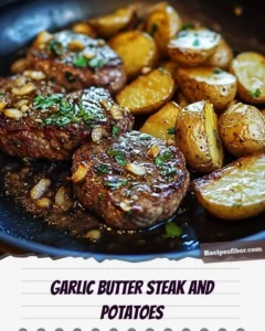 Plate of delicious garlic butter steak served with roasted potatoes
