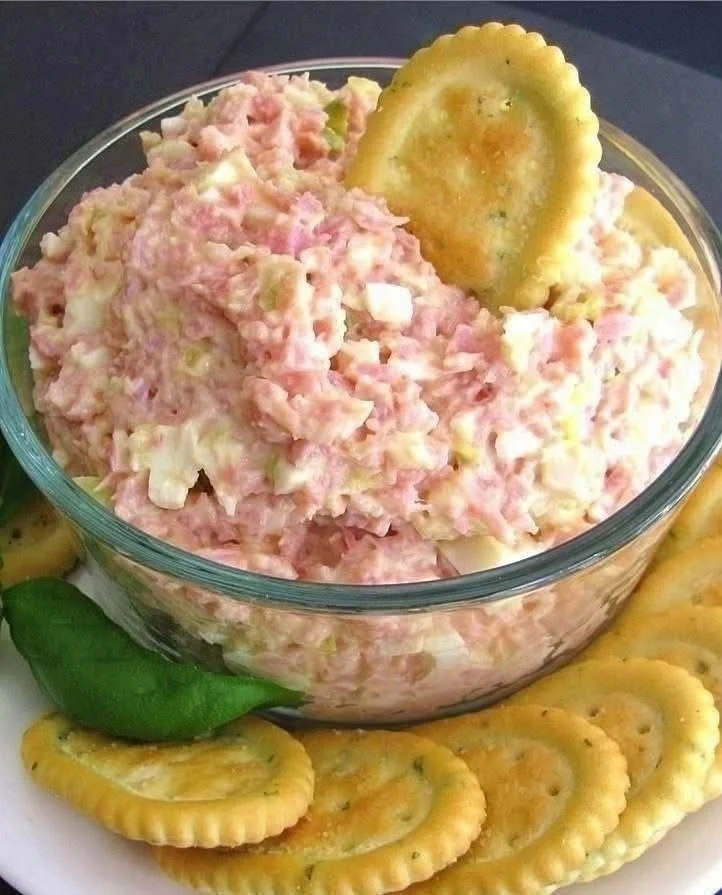 Delicious deviled ham salad served in a bowl with fresh herbs