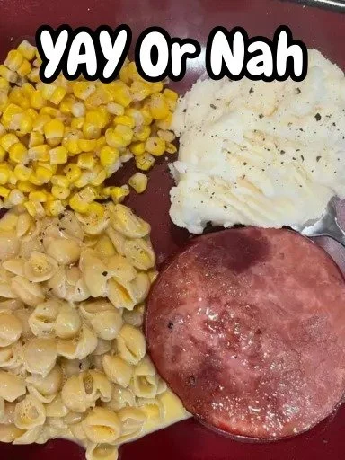 Delicious easy baked ham steaks served on a plate with garnishes.