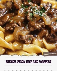 Delicious plate of French onion beef and noodles topped with melted cheese.