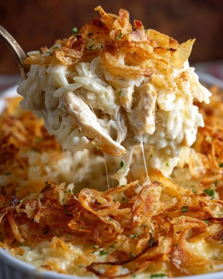 French Onion Chicken and Rice Casserole topped with cheese and onions
