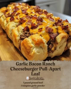 Delicious Garlic Bacon Ranch Cheeseburger Pull-Apart Loaf garnished with herbs.