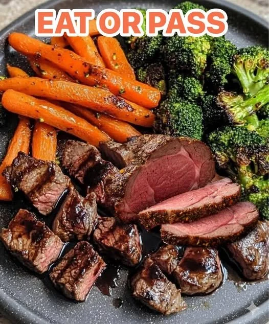 Garlic prime rib bites served with roasted carrots and charred broccoli