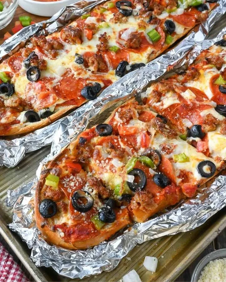 Delicious grilled French bread pizza with fresh toppings and melted cheese