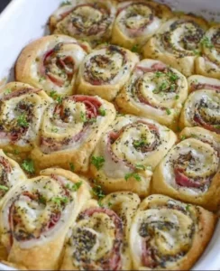 Ham and cheese crescent rolls baked golden brown on a plate