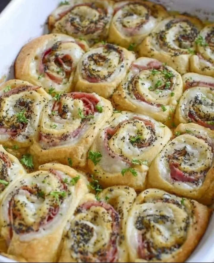 Ham and cheese crescent rolls baked golden brown on a plate