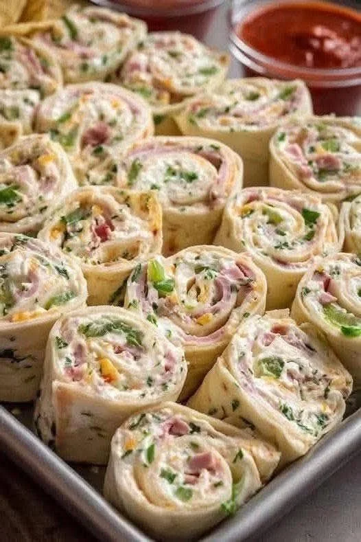 Stack of homemade pancakes with syrup and berries on a plate