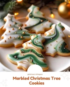 Marbled Christmas tree cookies decorated with icing and sprinkles