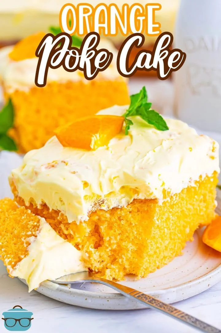 Delicious Orange Poke Cake topped with orange glaze and fresh orange slices.