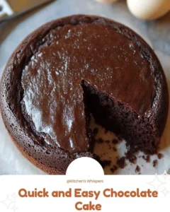 Delicious quick and easy chocolate cake topped with frosting and chocolate shavings