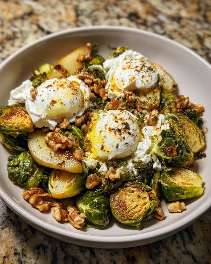 Skillet of roasted Brussels sprouts with pear, burrata, walnuts, and hot honey