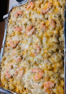 Delicious bowl of Seafood Mac and Cheese topped with fresh herbs