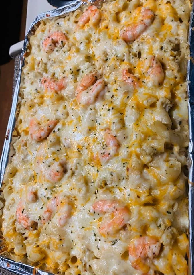 Delicious bowl of Seafood Mac and Cheese topped with fresh herbs