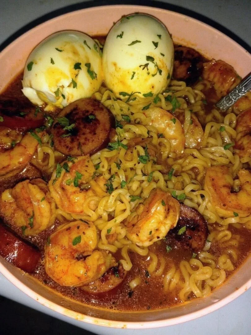 Shrimp and sausage ramen bowl, a hearty and flavorful dish with fresh ingredients.