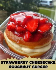 Strawberry Cheesecake Doughnut Burger with fresh strawberries and drizzle