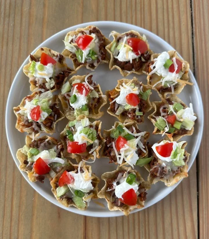 Plate of delicious taco bites served with dipping sauce