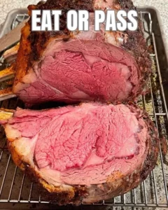 Juicy and tender prime rib roast cooked to perfection, garnished elegantly.