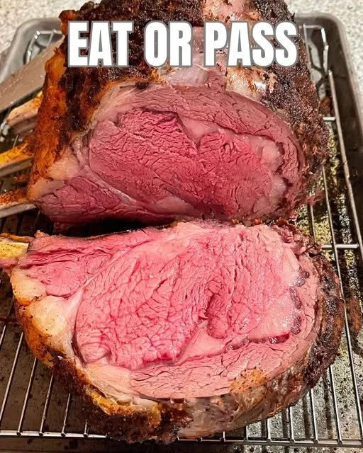 Juicy and tender prime rib roast cooked to perfection, garnished elegantly.