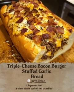 Triple-cheese bacon burger stuffed in garlic bread served on a plate