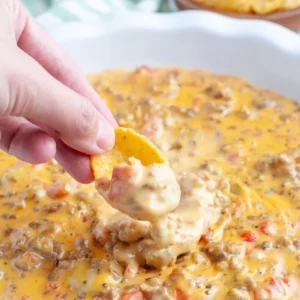 Creamy Velveeta Sausage Dip served in a bowl with chips