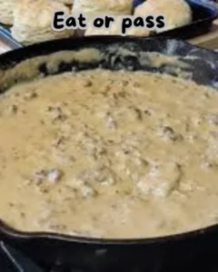 Homemade white gravy served over biscuits and mashed potatoes