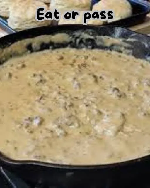 Homemade white gravy served over biscuits and mashed potatoes