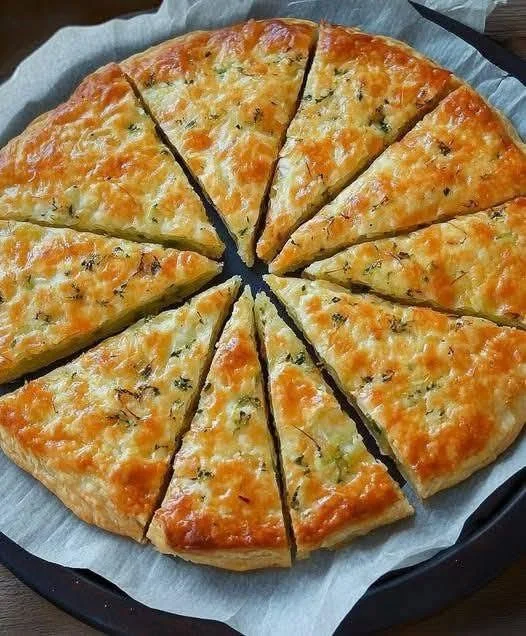 30-Minute Margherita Pizza fresh out of the oven, topped with basil and mozzarella.