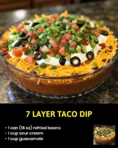 7 Layer Taco Dip with beans, cheese, and fresh toppings