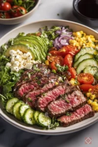 A delicious steak salad with fresh greens and perfectly cooked steak