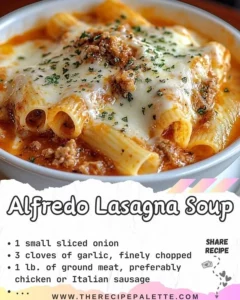 A bowl of creamy Alfredo Lasagna Soup garnished with herbs and cheese.
