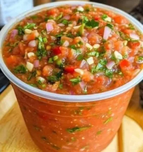 Bowl of amazing homemade salsa with fresh tomatoes, onions, and cilantro