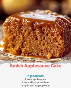 Delicious homemade Amish Applesauce Cake served on a rustic wooden table.