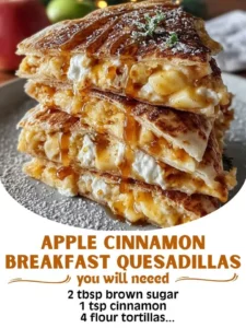 Apple cinnamon quesadillas served on a plate, topped with fresh apples and cinnamon