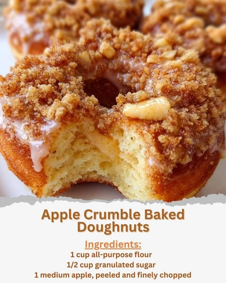 Delicious apple crumble baked doughnuts topped with crumbled apple and cinnamon.