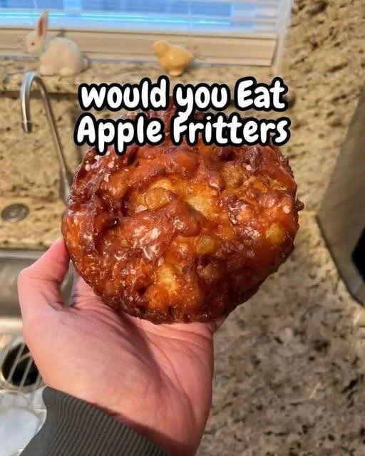 Delicious homemade apple fritters with powdered sugar topping.
