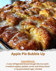 Slice of Apple Pie Bubble Up served with whipped cream on a plate