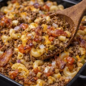 Delicious Bacon Cheeseburger Noodle Bake topped with melted cheese and crispy bacon